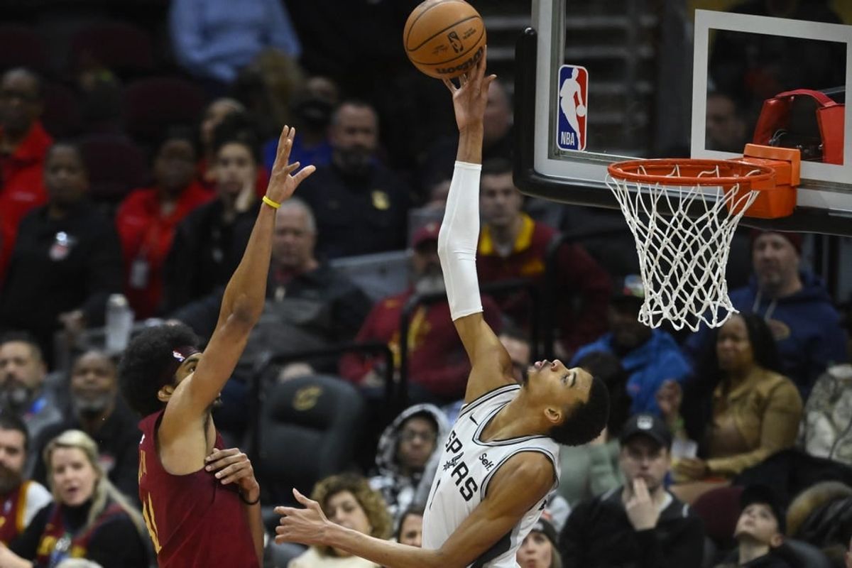 Jan 7, 2024; Cleveland, Ohio, USA; San Antonio Spurs center Victor Wembanyama (1) blocks a shot by Cleveland Cavaliers center Jarrett Allen (31) in the fourth quarter at Rocket Mortgage FieldHouse.