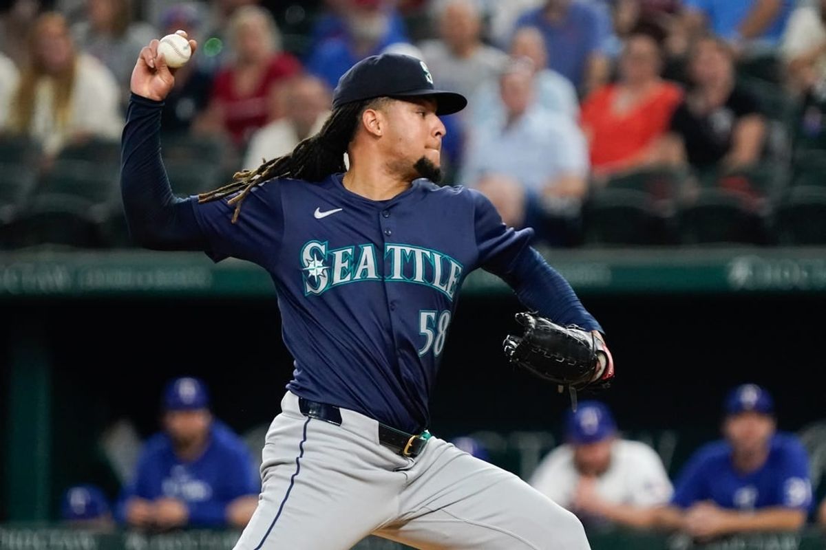 Apr 25, 2024; Arlington, Texas, USA; Seattle Mariners pitcher Luis Castillo (58) throws to the plate during the second inning against the Texas Rangers at Globe Life Field.