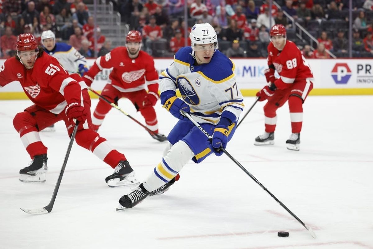 Mar 16, 2024; Detroit, Michigan, USA;  Buffalo Sabres right wing JJ Peterka (77) skates with the puck in the first period against the Detroit Red Wings at Little Caesars Arena.