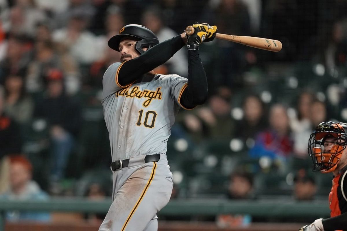 Apr 27, 2024; San Francisco, California, USA; Pittsburgh Pirates left fielder Bryan Reynolds (10) hits a home run against the San Francisco Giants during the tenth inning at Oracle Park.
