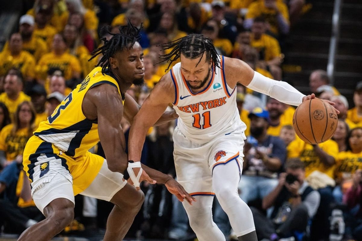 May 10, 2024; Indianapolis, Indiana, USA; New York Knicks guard Jalen Brunson (11) dribbles the ball while Indiana Pacers forward Aaron Nesmith (23) defends during game three of the second round for the 2024 NBA playoffs at Gainbridge Fieldhouse.