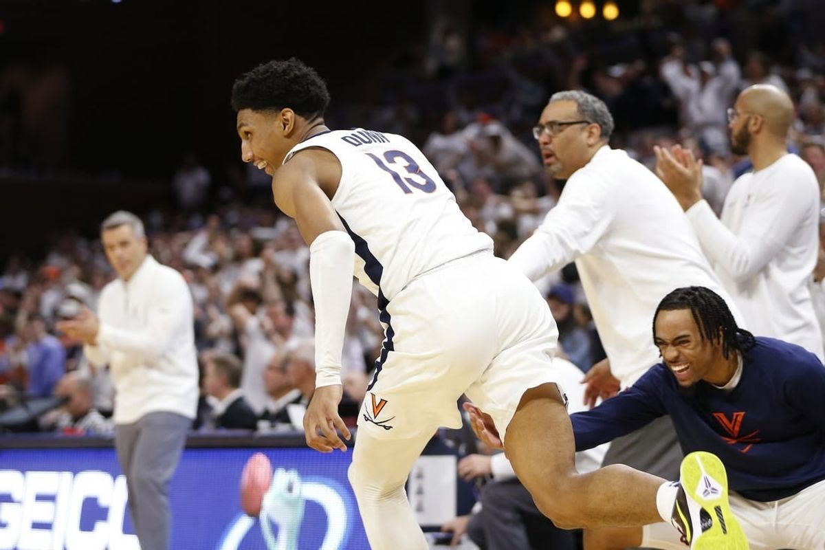 Feb 5, 2024; Charlottesville, Virginia, USA; Virginia Cavaliers guard Ryan Dunn (13) celebrates after dunking the ball against the Miami (Fl) Hurricanes during the second half at John Paul Jones Arena.