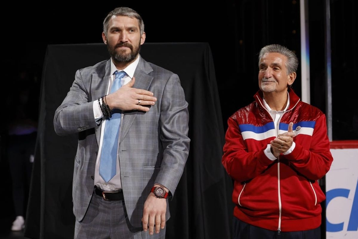 Apr 26, 2022; Washington, District of Columbia, USA; Injured Washington Capitals left wing Alex Ovechkin (L) gestures to fans while standing next to Capitals owner Ted Leonsis (R) during a ceremony honoring his becoming 3rd highest goal scorer in NHL history prior to the Capitals game against the New York Islanders at Capital One Arena.