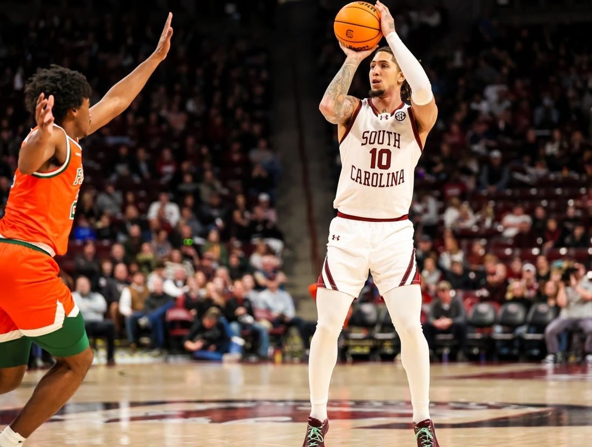Dec 30, 2023; Columbia, South Carolina, USA; South Carolina Gamecocks guard Myles Stute (10) attempts a three point basket against the Florida A&M Rattlers in the first quarter at Colonial Life Arena.