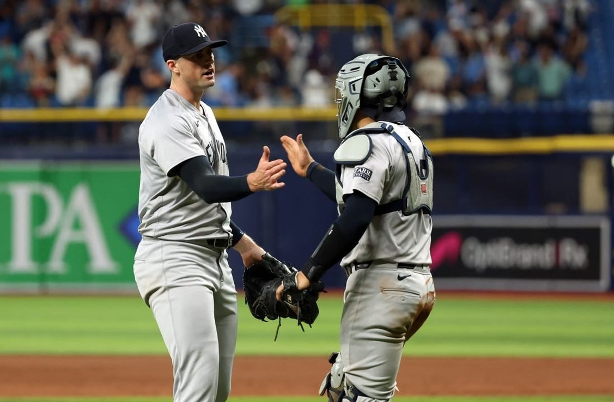 May 10, 2024; St. Petersburg, Florida, USA;  New York Yankees pitcher Clay Holmes (35) and catcher Jose Trevino (39) celebrate after they beat the Tampa Bay Rays at Tropicana Field.