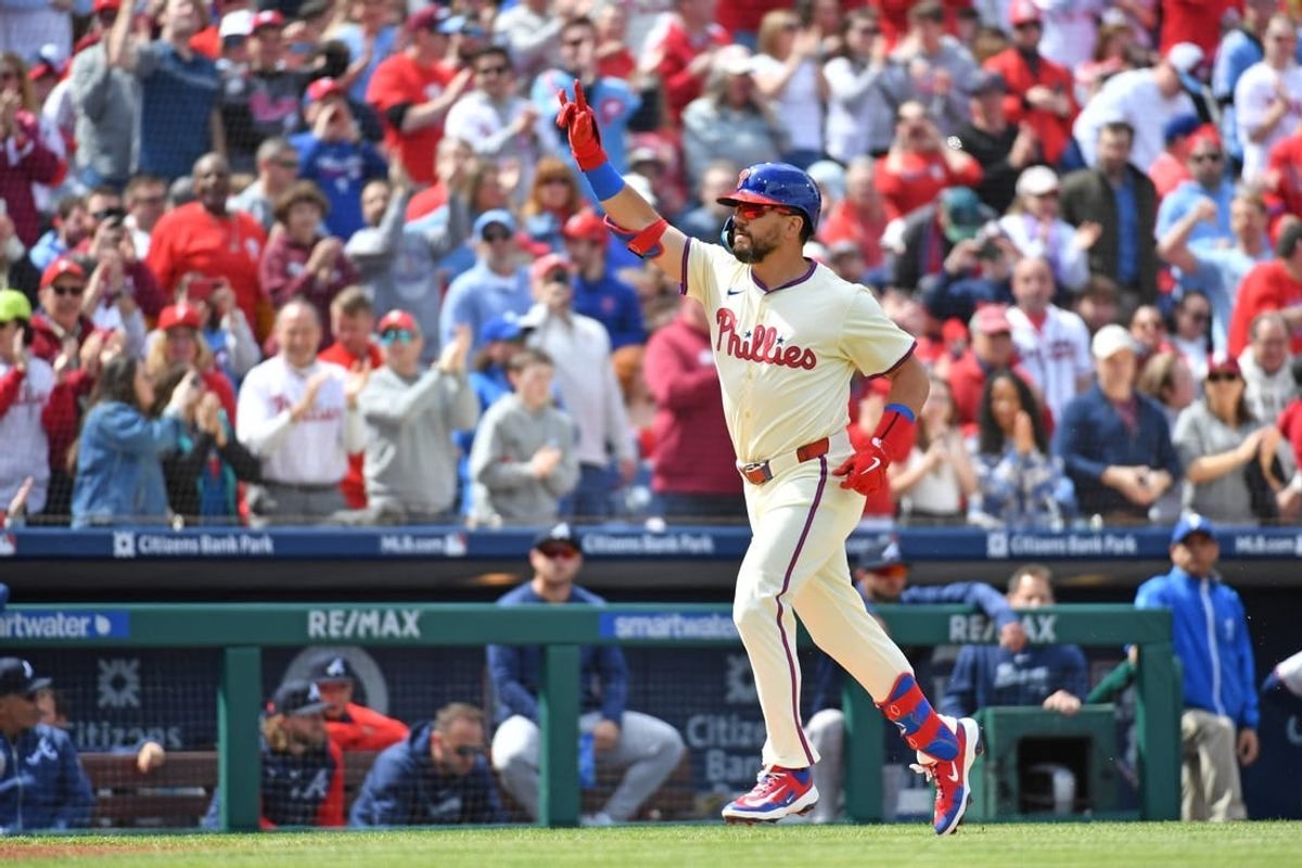 Mar 31, 2024; Philadelphia, Pennsylvania, USA; Philadelphia Phillies designated hitter Kyle Schwarber (12) celebrates his home run during the first inning against the Atlanta Braves at Citizens Bank Park.
