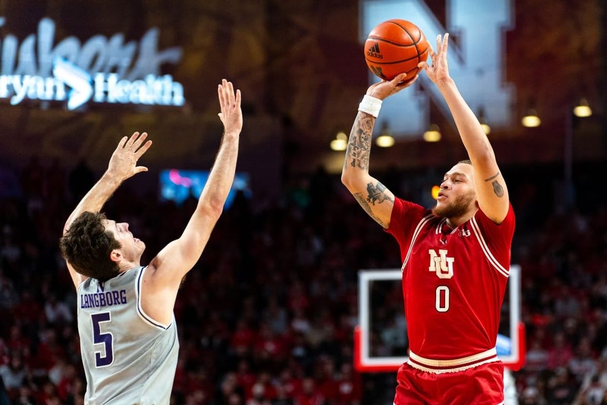 Jan 20, 2024; Lincoln, Nebraska, USA; Nebraska Cornhuskers guard C.J. Wilcher (0) shoots a three-point shot against Northwestern Wildcats guard Ryan Langborg (5) during the first half at Pinnacle Bank Arena.