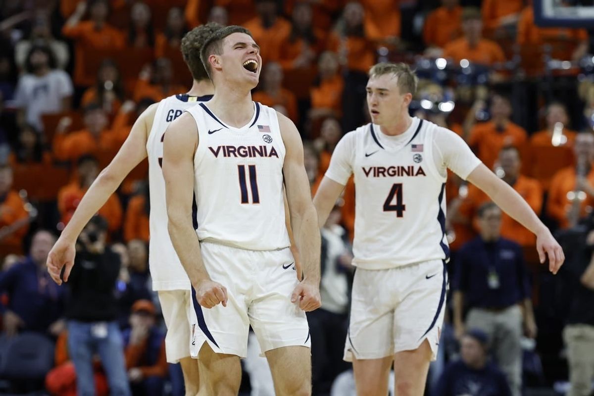Nov 29, 2023; Charlottesville, Virginia, USA; Virginia Cavaliers guard Isaac McKneely (11) celebrates after the Cavaliers' game against the Texas A&M Aggies at John Paul Jones Arena.