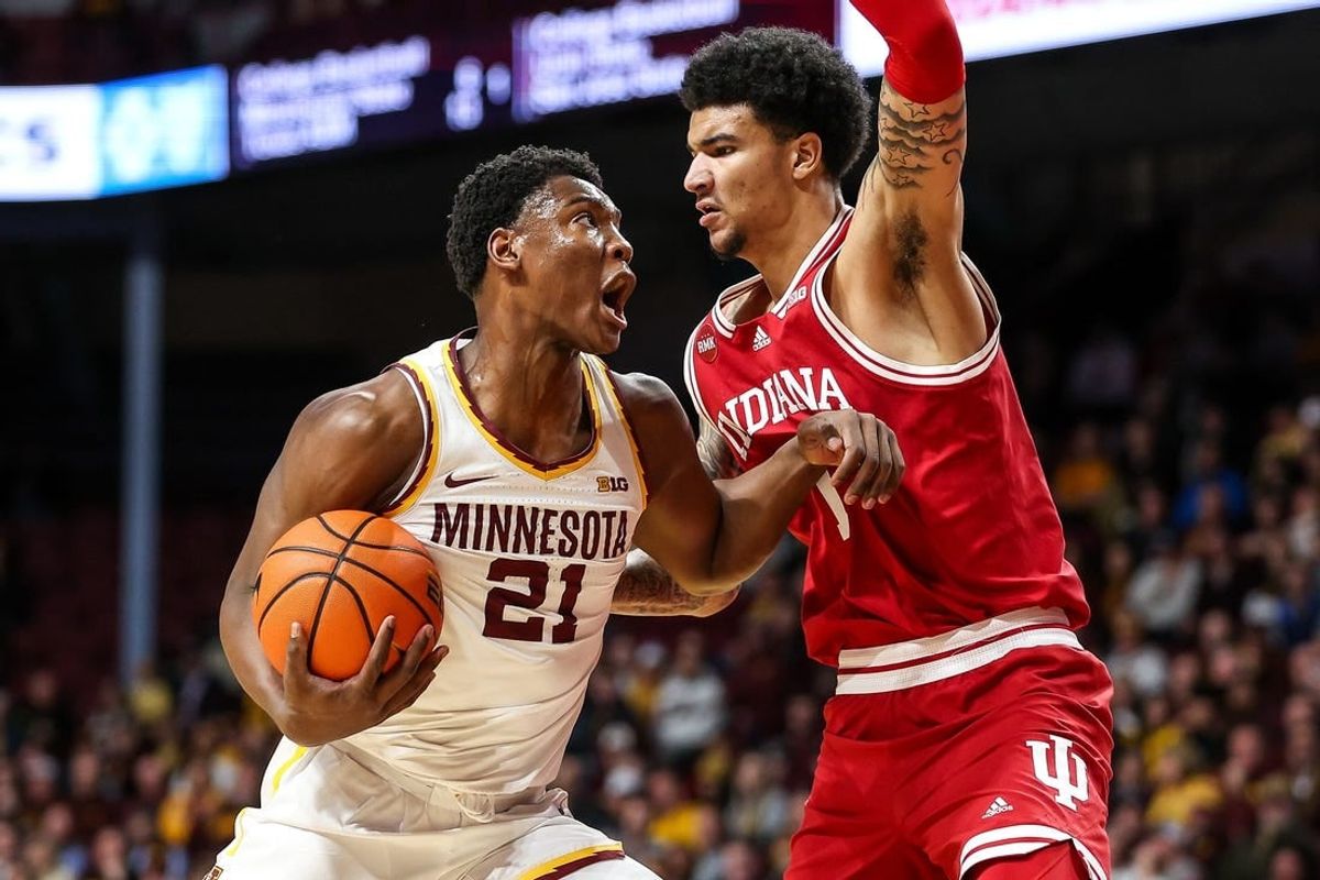 Mar 6, 2024; Minneapolis, Minnesota, USA; Minnesota Golden Gophers forward Pharrel Payne (21) works around Indiana Hoosiers center Kel'el Ware (1)  during the first half at Williams Arena.