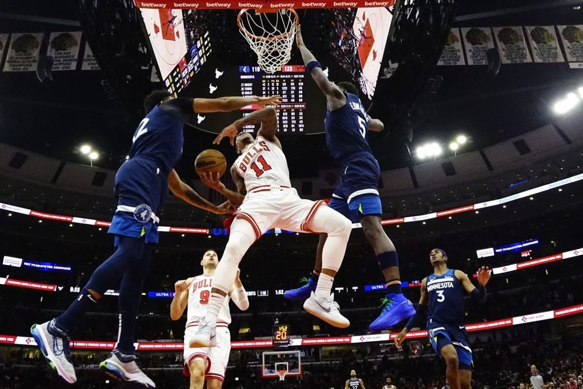 Feb 6, 2024; Chicago, Illinois, USA; Chicago Bulls forward DeMar DeRozan (11) is defended by Minnesota Timberwolves guard Anthony Edwards (5) during the second half at United Center.