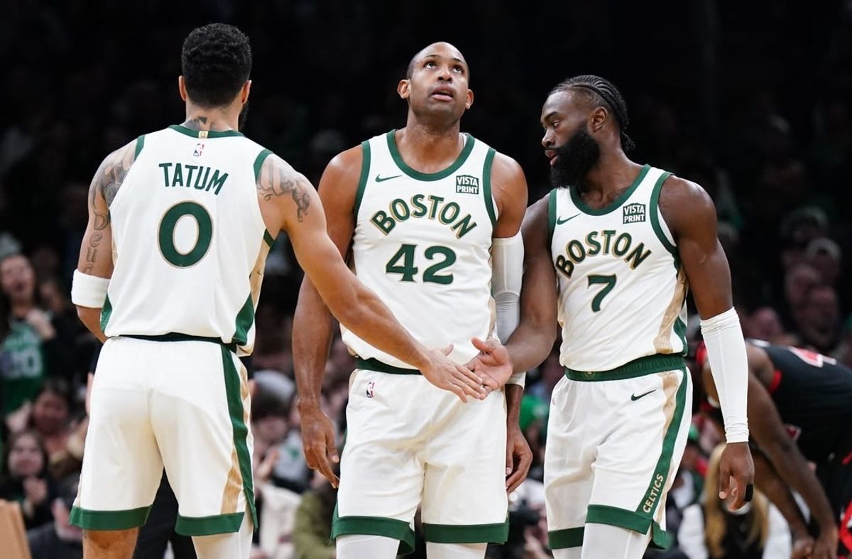Nov 28, 2023; Boston, Massachusetts, USA; Boston Celtics guard Jaylen Brown (7) with forward Jayson Tatum (0) and center Al Horford (42) after his basket against the Chicago Bulls in the second half at TD Garden.