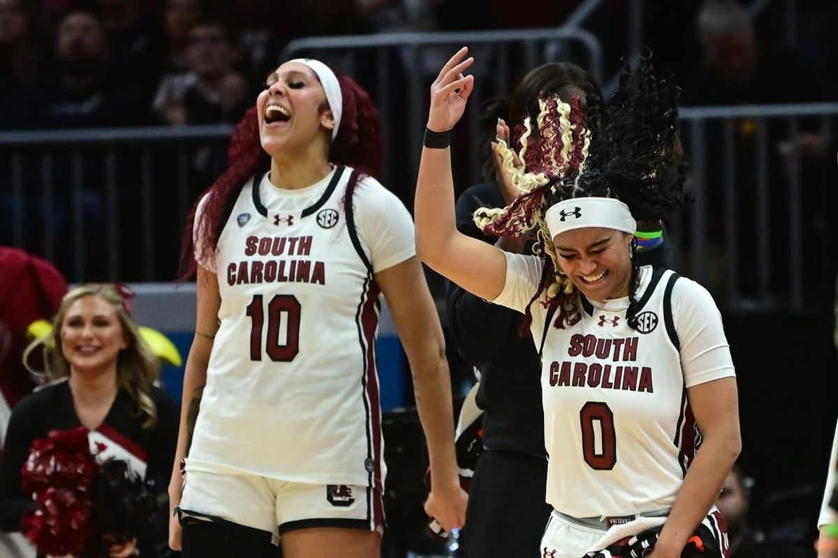Apr 5, 2024; Cleveland, OH, USA; South Carolina Gamecocks center Kamilla Cardoso (10) and guard Te-Hina Paopao (0) react on the bench against the NC State Wolfpack in the semifinals of the Final Four of the womens 2024 NCAA Tournament at Rocket Mortgage FieldHouse.