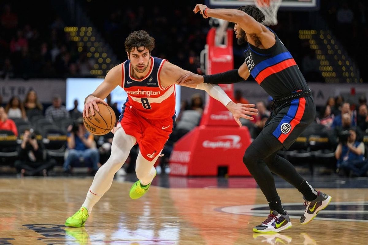 Mar 29, 2024; Washington, District of Columbia, USA; Washington Wizards forward Deni Avdija (8) drives to the basket against Detroit Pistons forward Troy Brown Jr. (7) at Capital One Arena.