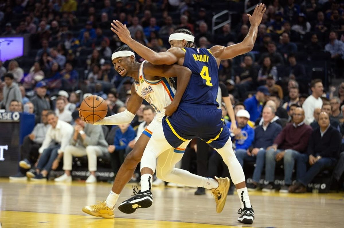 Nov 16, 2023; San Francisco, California, USA; Oklahoma City Thunder guard Shai Gilgeous-Alexander (2) commits an offensive foul on Golden State Warriors guard Moses Moody (4) during the second quarter at Chase Center.