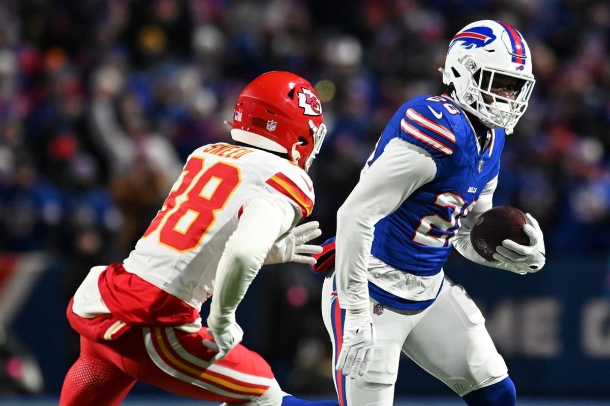 Jan 21, 2024; Orchard Park, New York, USA; Buffalo Bills running back Latavius Murray (28) rushes the ball against  Kansas City Chiefs cornerback L'Jarius Sneed (38)in the first half of the 2024 AFC divisional round game at Highmark Stadium.