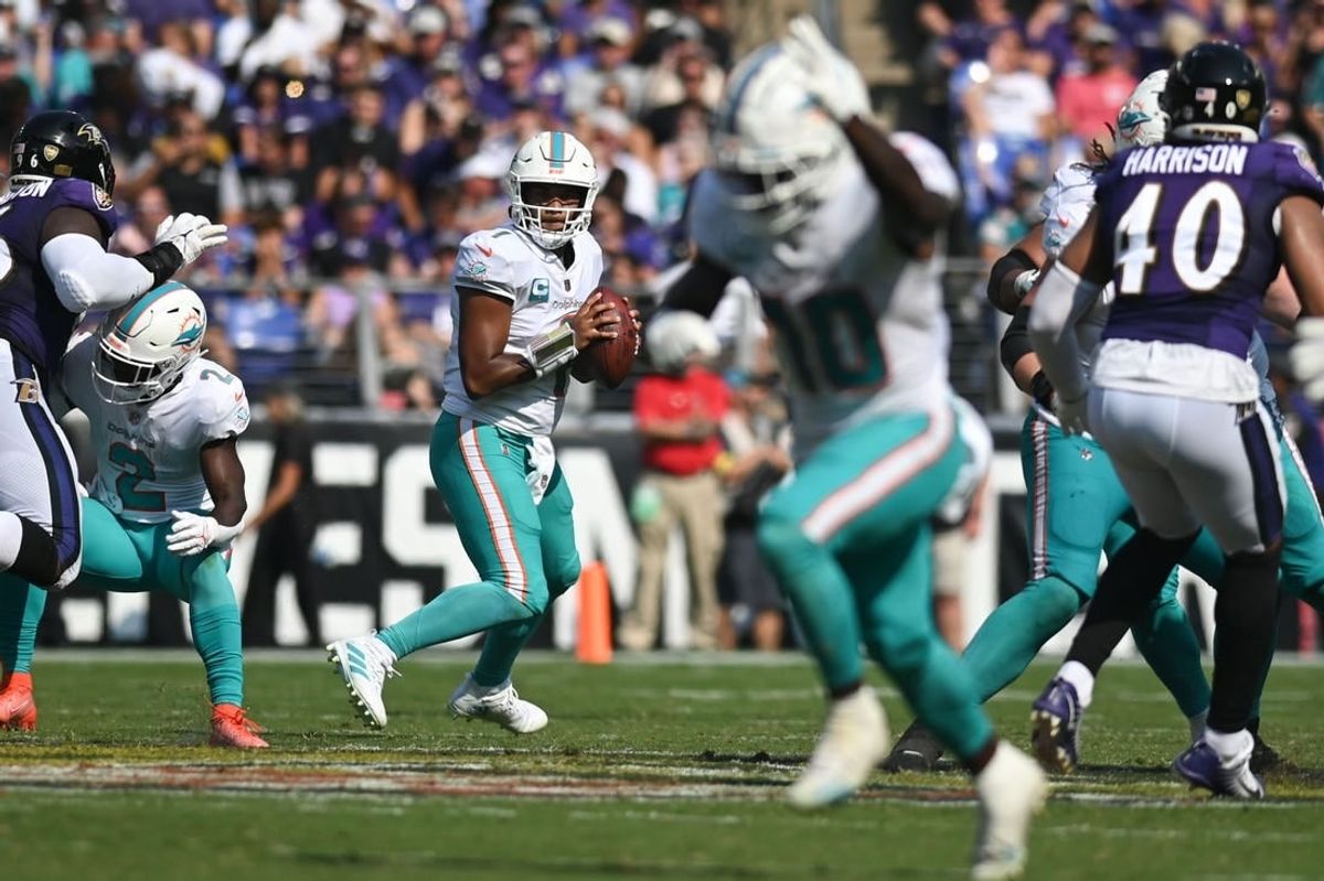 Miami Dolphins quarterback Tua Tagovailoa (1) looks to wide receiver Tyreek Hill (10) during the 2022 matchup with the Baltimore Ravens at M&T Bank Stadium.
