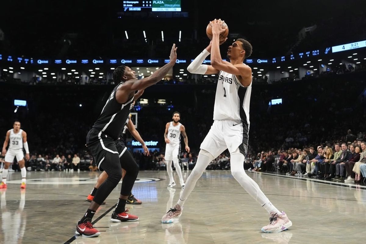 Feb 10, 2024; Brooklyn, New York, USA; San Antonio Spurs center Victor Wembanyama (1) shoots a jump shot against the Brooklyn Nets  during the first quarter at Barclays Center.