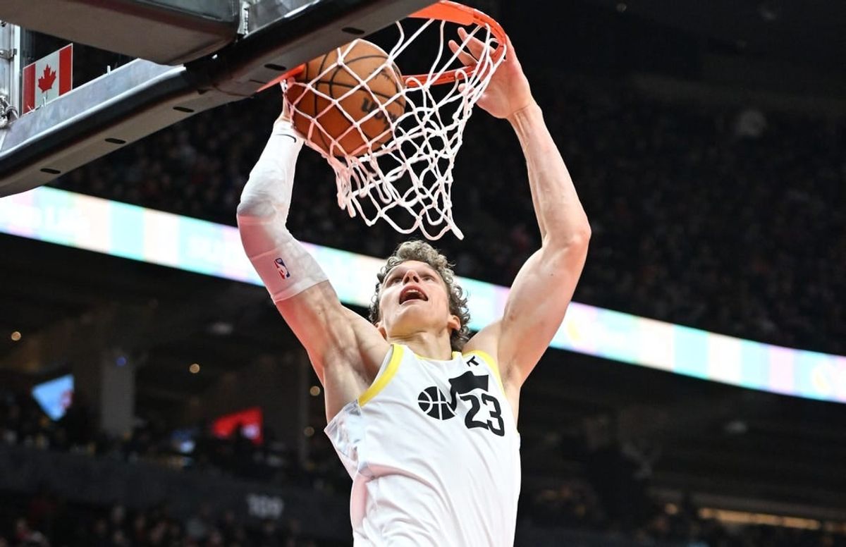 Dec 23, 2023; Toronto, Ontario, CAN;  Utah Jazz forward Lauri Markkanen (23) dunks for a basket against the Toronto Raptors in the second half at Scotiabank Arena.