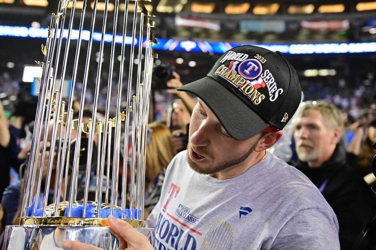 Nov 1, 2023; Phoenix, AZ, USA; Texas Rangers catcher Mitch Garver (18) celebrates defeating the Arizona Diamondbacks to win the World Series in game five of the 2023 World Series at Chase Field.