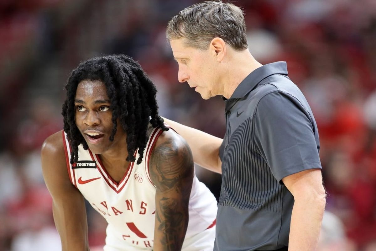 Feb 10, 2024; Fayetteville, Arkansas, USA; Arkansas Razorbacks guard Keyon Menifield Jr (1) talks to head coach Eric Musselman during the second half against the Georgia Bulldogs at Bud Walton Arena. Arkansas won 78-75.