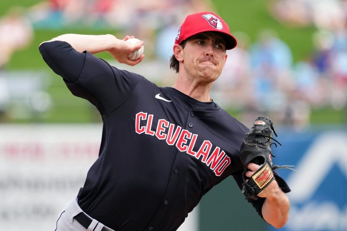 Mar 12, 2024; Surprise, Arizona, USA; Cleveland Guardians starting pitcher Shane Bieber (57) bats against the Texas Rangers during the second inning at Surprise Stadium.