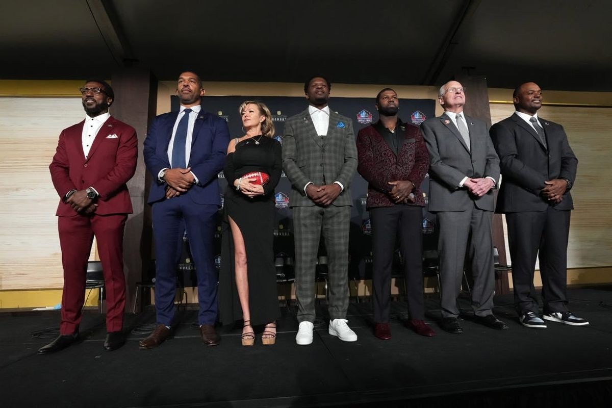 Feb 8, 2024; Las Vegas, NV, USA; Pro Football Hall of Fame Class of 2024 inductees pose at press conference at the Resorts World Theatre. From left: Patrick Willis, Julius Peppers, Misty McMichael (representing Steve McMichael), Andre Johnson, Devin Hester, Randy Grdishar and Dwight Freeney.