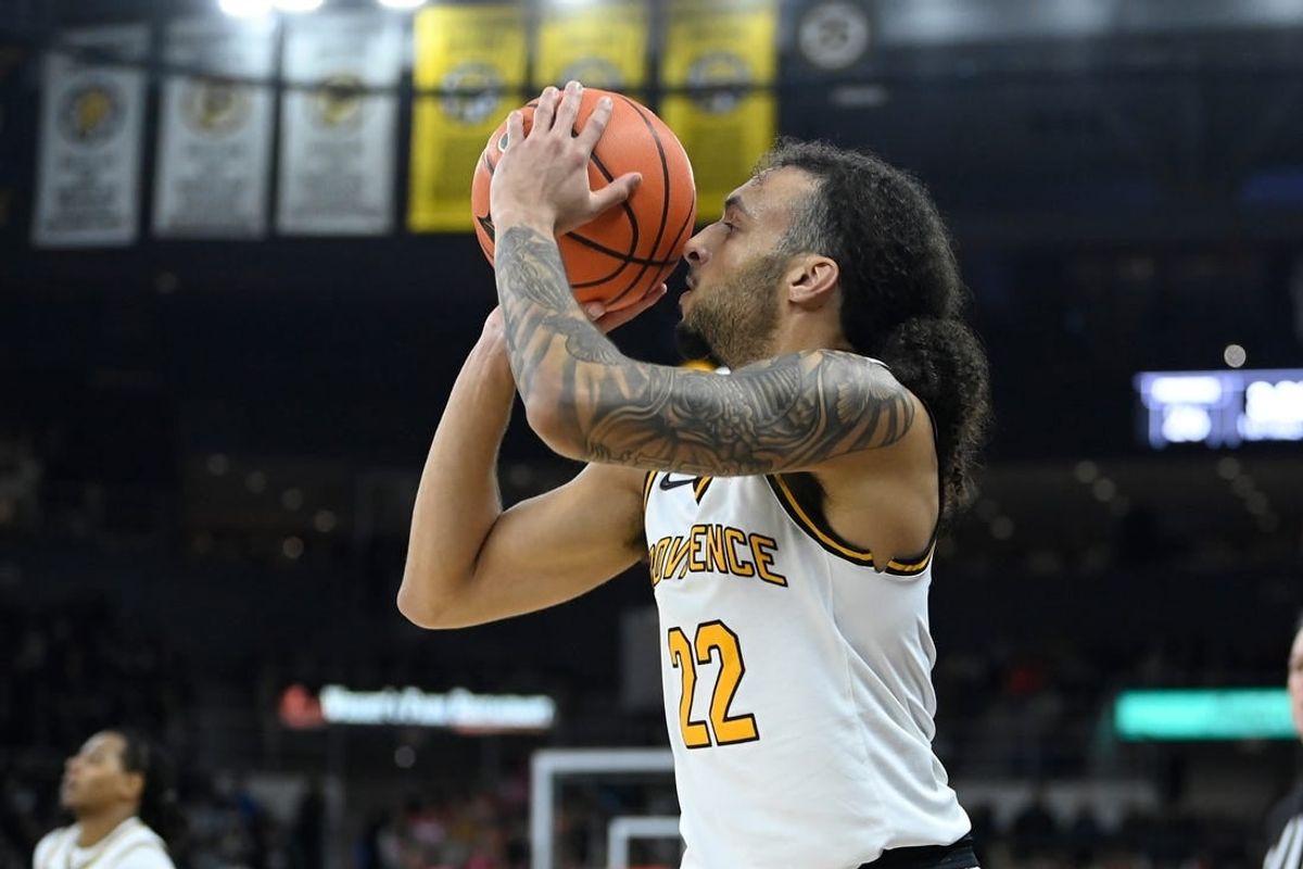 Feb 17, 2024; Providence, Rhode Island, USA; Providence Friars guard Devin Carter (22) shoots the ball against the DePaul Blue Demons during the first half at Amica Mutual Pavilion.