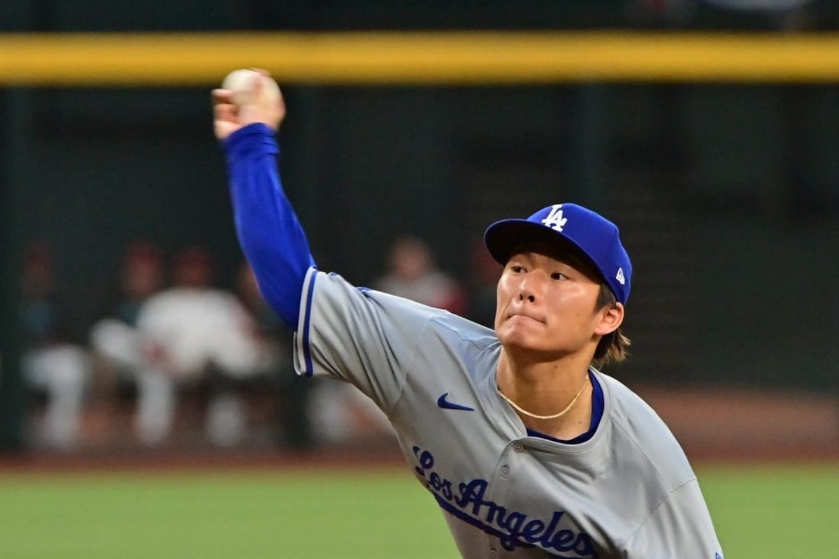 May 1, 2024; Phoenix, Arizona, USA;  Los Angeles Dodgers pitcher Yoshinobu Yamamoto (18) throws in the first inning against the Arizona Diamondbacks at Chase Field.