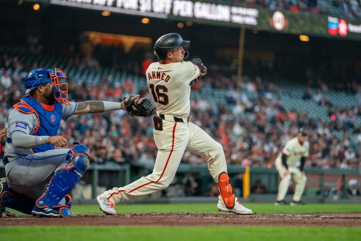 Apr 22, 2024; San Francisco, California, USA;  San Francisco Giants shortstop Nick Ahmed (16) hits a two run RBI single against the New York Mets during the second inning at Oracle Park.