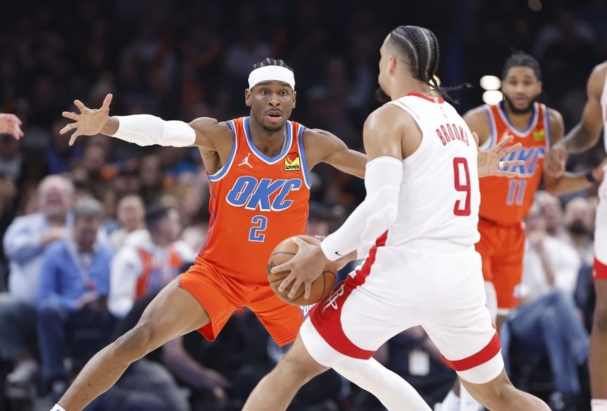 Feb 27, 2024; Oklahoma City, Oklahoma, USA; Oklahoma City Thunder guard Shai Gilgeous-Alexander (2) defends Houston Rockets forward Dillon Brooks (9) during the second quarter at Paycom Center.