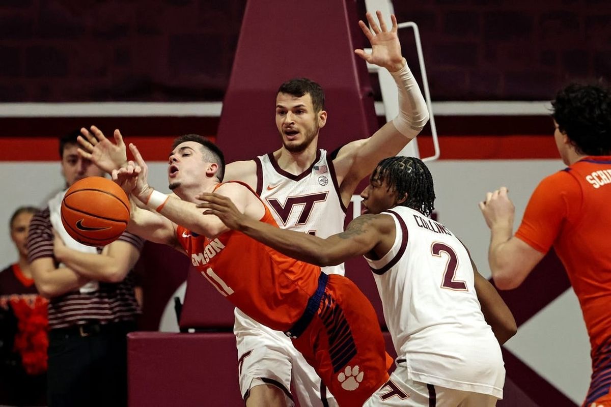 Jan 10, 2024; Blacksburg, Virginia, USA; Virginia Tech Hokies guard MJ Collins (2) knocks the ball away from Clemson Tigers guard Joseph Girard III (11) during the second half at Cassell Coliseum.