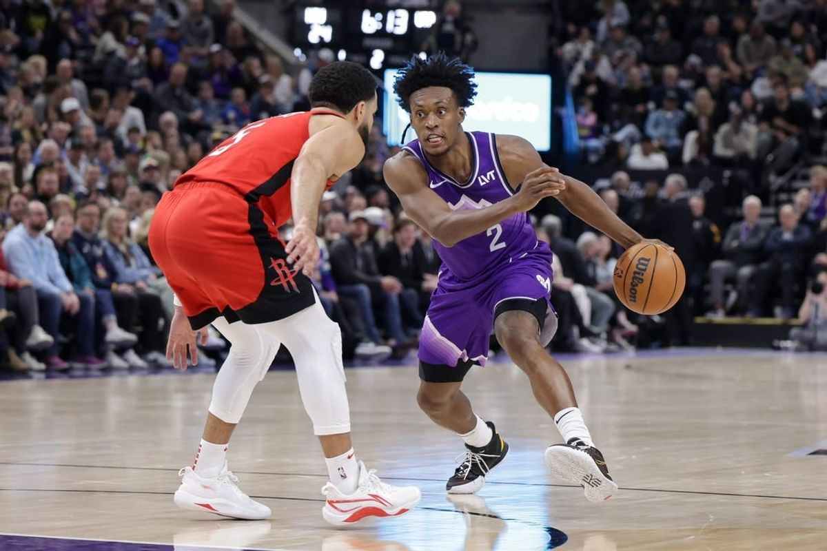 Mar 29, 2024; Salt Lake City, Utah, USA;  Utah Jazz guard Collin Sexton (2) tries to dribble past Houston Rockets guard Fred VanVleet (5) during the second quarter at Delta Center.
