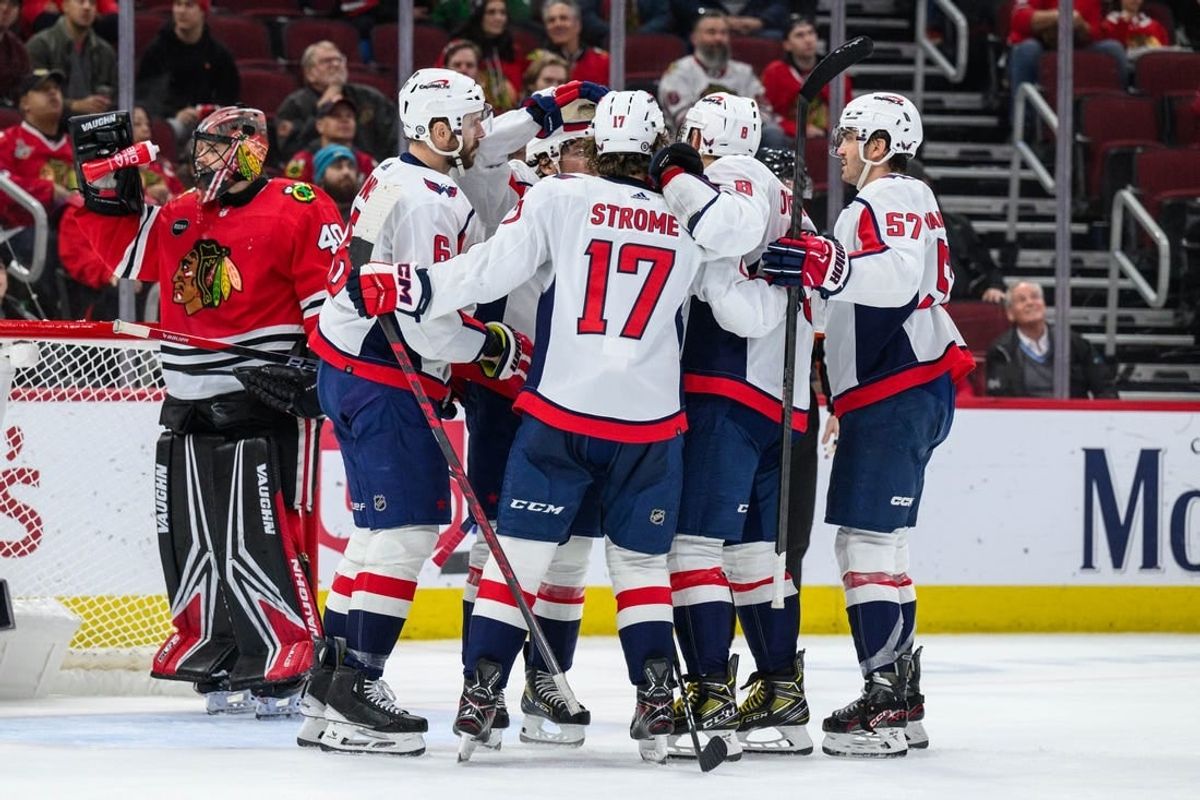 Dec 10, 2023; Chicago, Illinois, USA; Washington Capitals center Dylan Strome (17) celebrates his goal with teammates against the Chicago Blackhawks during the second period at the United Center.