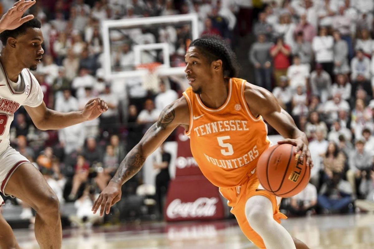 Mar 2, 2024; Tuscaloosa, Alabama, USA;  Tennessee guard Zakai Zeigler (5) drives against Alabama guard Rylan Griffen (3) at Coleman Coliseum.