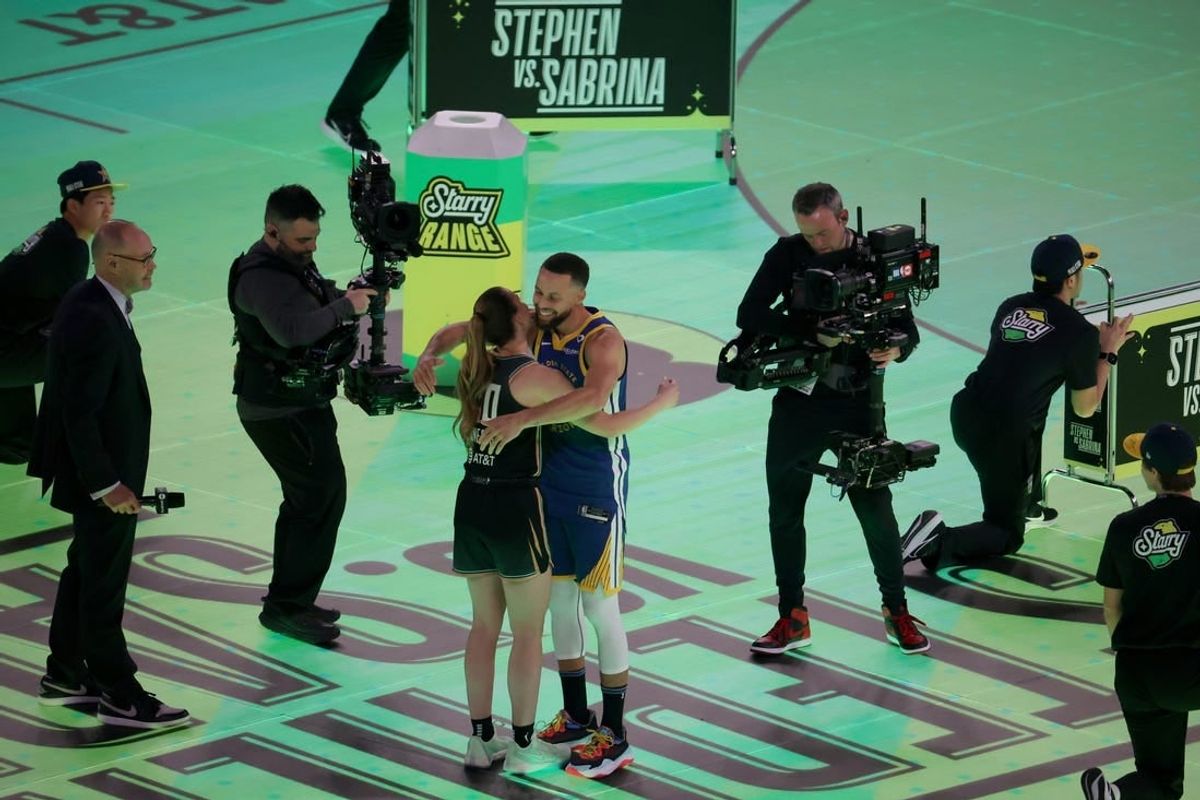 Feb 17, 2024; Indianapolis, IN, USA; Golden State Warriors guard Stephen Curry (30) competes in the Stephen vs. Sabrina 3-Point Challenge against New York Liberty guard Sabrina Ionescu (20) during NBA All Star Saturday Night at Lucas Oil Stadium.