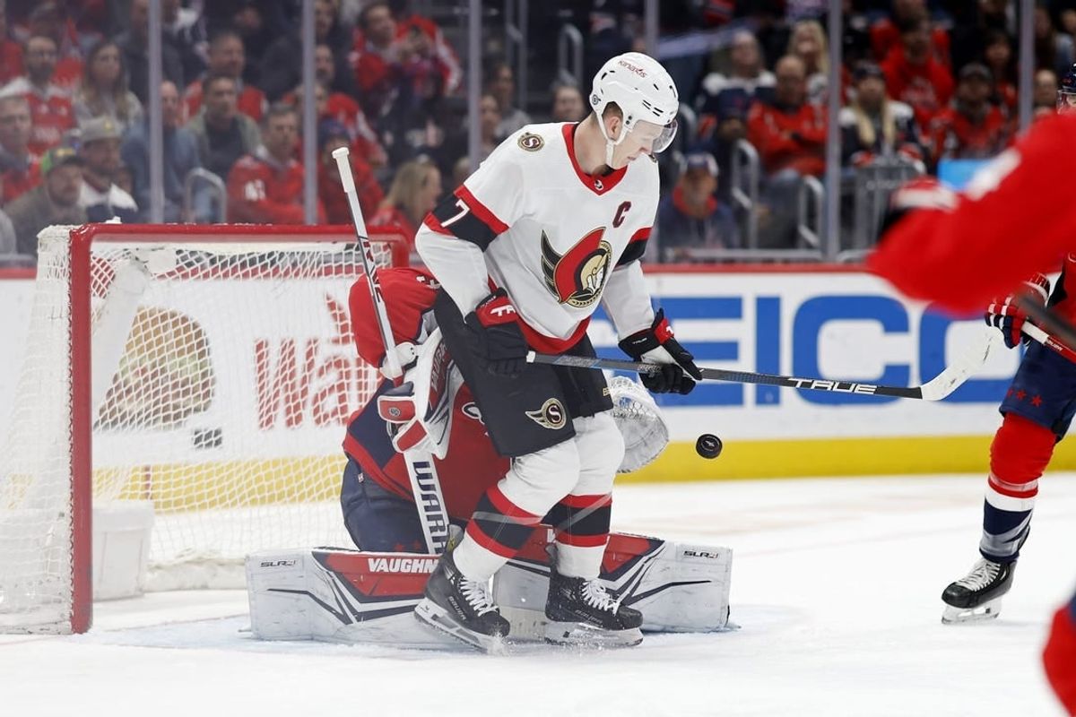 Feb 26, 2024; Washington, District of Columbia, USA; Washington Capitals goaltender Darcy Kuemper (35) makes a save on a deflection by Ottawa Senators left wing Brady Tkachuk (7) in the second period at Capital One Arena.