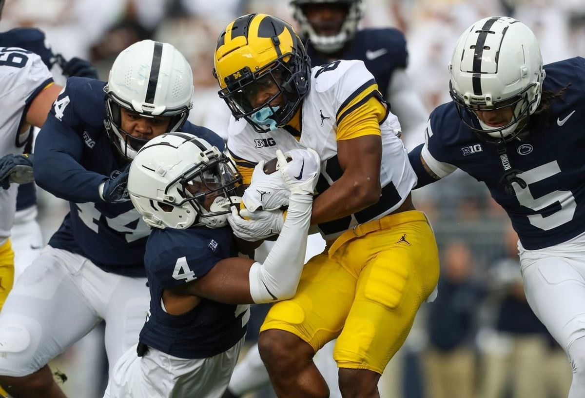 Nov 11, 2023; University Park, Pennsylvania, USA; Michigan Wolverines wide receiver Semaj Morgan (82) runs the ball against the Penn State Nittany Lions during the second quarter at Beaver Stadium.