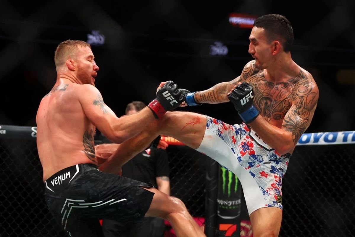 Apr 13, 2024; Las Vegas, Nevada, USA; Max Holloway (blue gloves) fights Justin Gaethje (red gloves) during UFC 300 at T-Mobile Arena.
