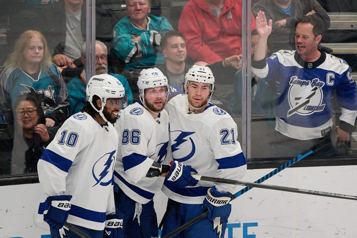 Mar 21, 2024; San Jose, California, USA; Tampa Bay Lightning center Brayden Point (21) celebrates with right wing Nikita Kucherov (86) and left wing Anthony Duclair (10) after scoring his second goal of the game against the San Jose Sharks during the third period at SAP Center at San Jose.