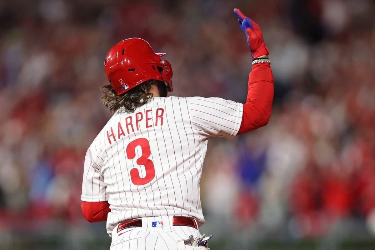 Oct 11, 2023; Philadelphia, Pennsylvania, USA; Philadelphia Phillies first baseman Bryce Harper (3) hits a solo during the fifth inning against the Atlanta Braves in game three of the NLDS for the 2023 MLB playoffs at Citizens Bank Park.