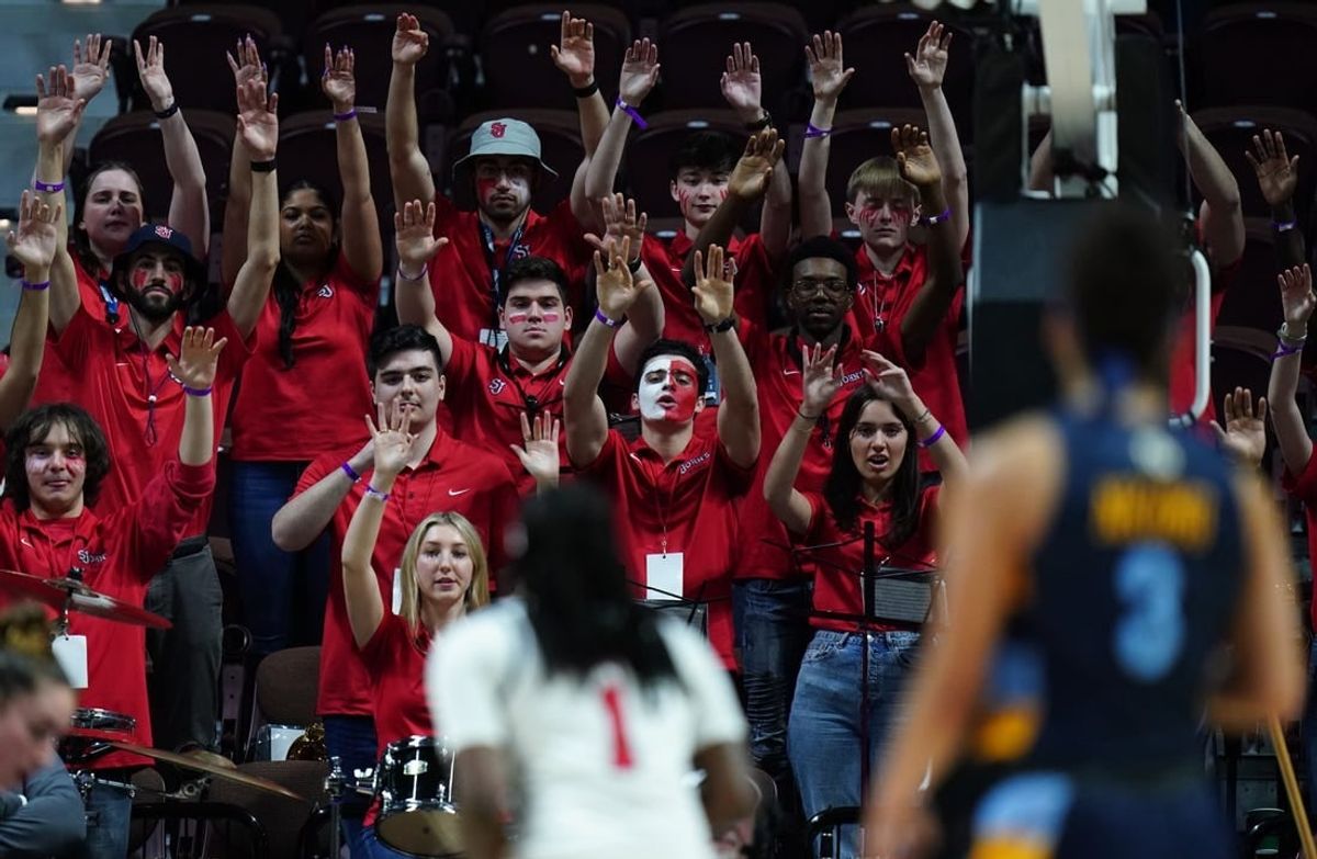 Mar 4, 2023; Uncasville, CT, USA; The St. John's Red Storm band shows support for guard Unique Drake (1) as she throws a free-throw against the Marquette Golden Eagles in the second half at Mohegan Sun Arena.