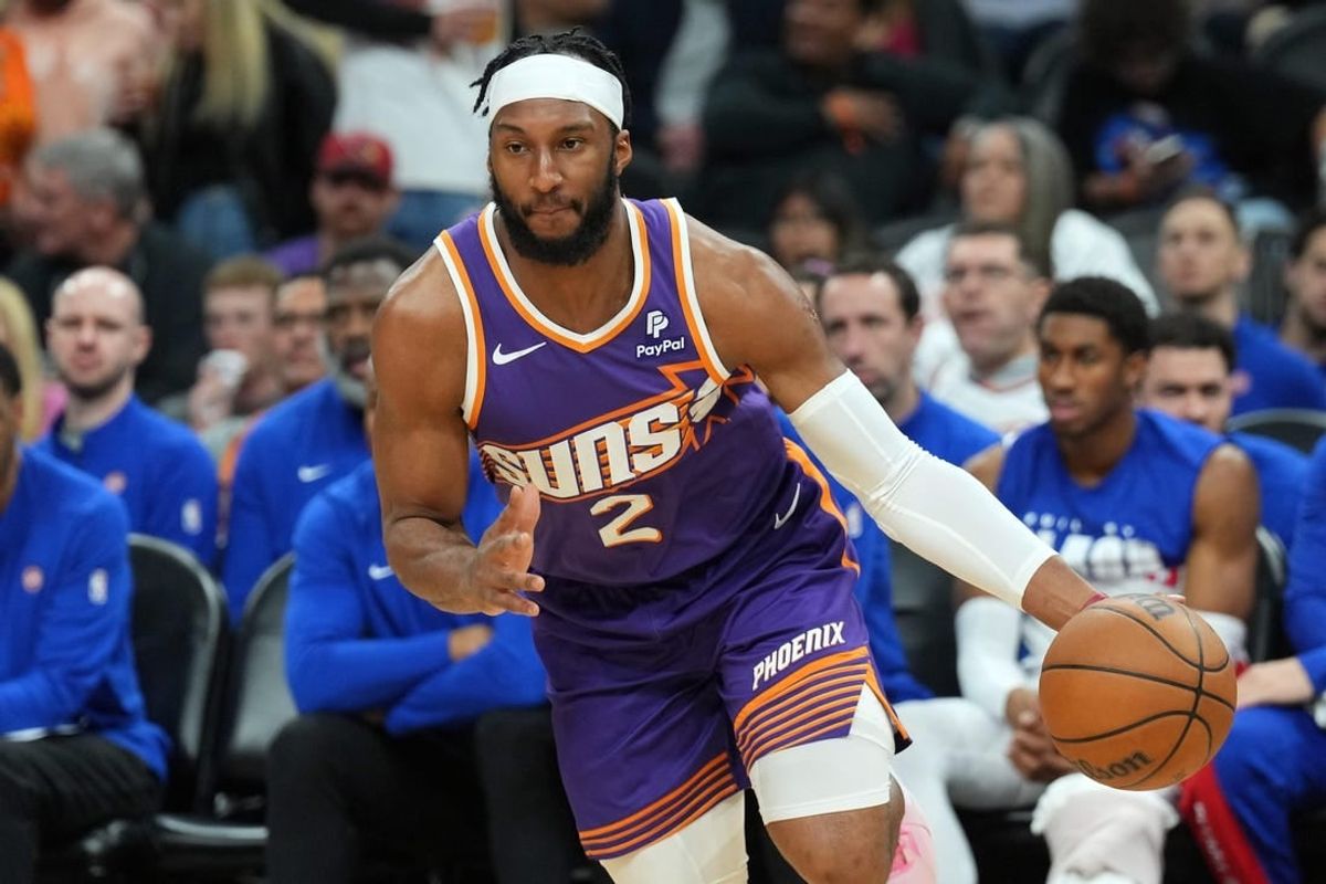Feb 14, 2024; Phoenix, Arizona, USA; Phoenix Suns forward Josh Okogie (2) dribbles against the Detroit Pistons during the first half at Footprint Center.
