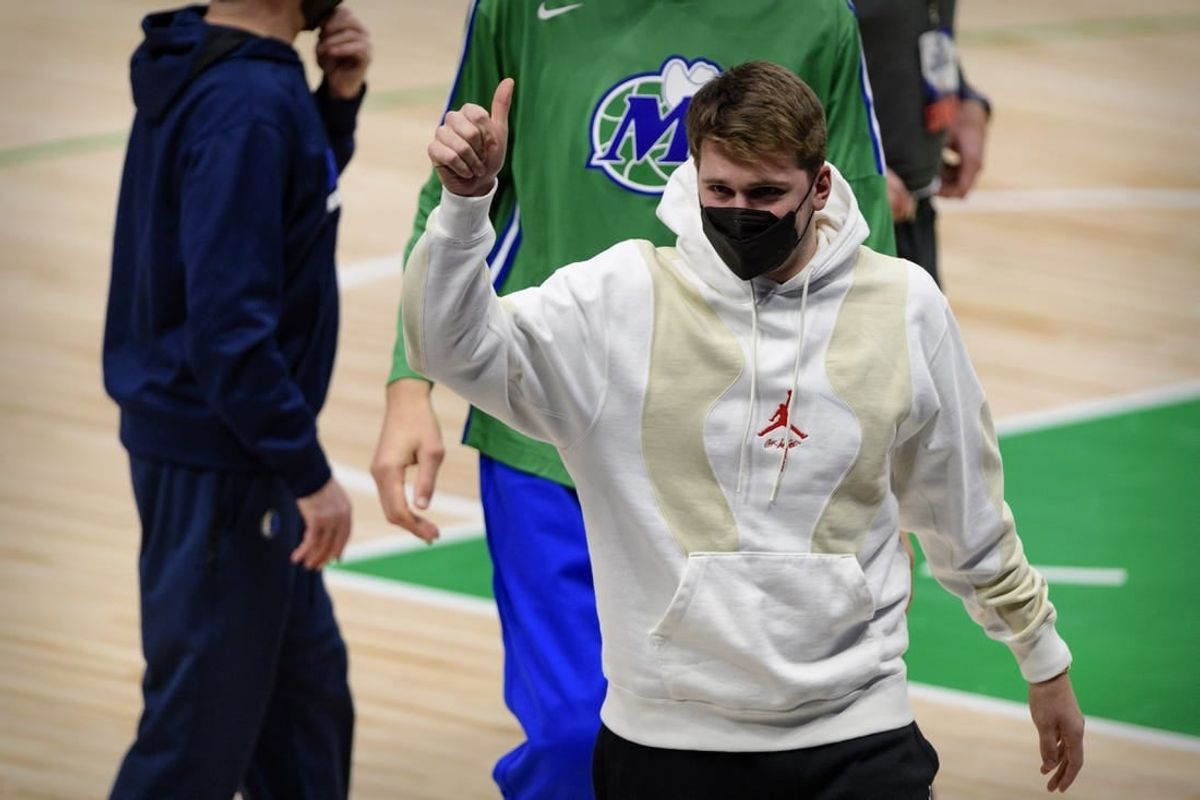 Dallas Mavericks guard Luka Doncic (77) gives a thumbs up to the crowd as he walks off the court after the game between the Dallas Mavericks and the Oklahoma City Thunder at the American Airlines Center.
