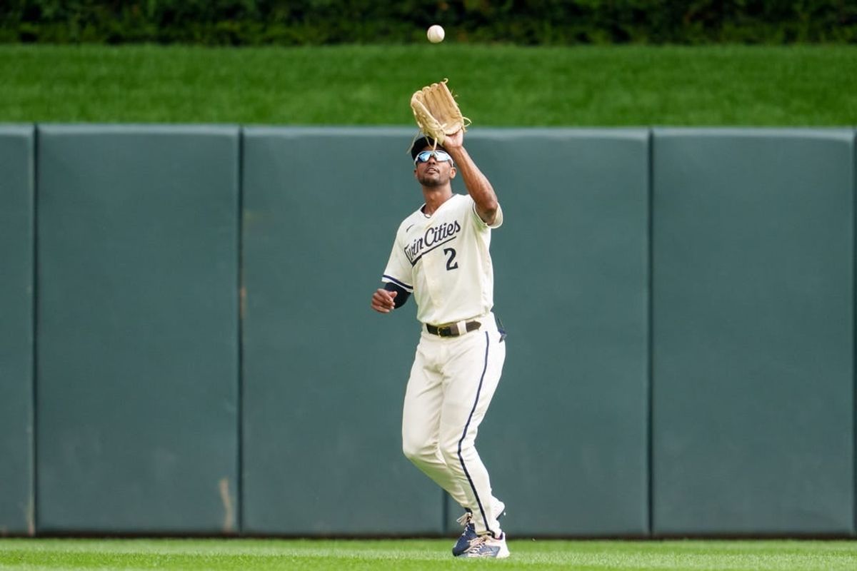 Sep 24, 2023; Minneapolis, Minnesota, USA; Minnesota Twins center fielder Michael A. Taylor (2) catches a ball to retire Los Angeles Angels catcher Logan O'Hoppe (14) in the second inning at Target Field.