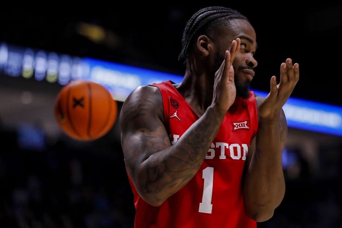 Dec 1, 2023; Cincinnati, Ohio, USA; Houston Cougars guard Jamal Shead (1) reacts after a play against the Xavier Musketeers in the second half at Cintas Center.