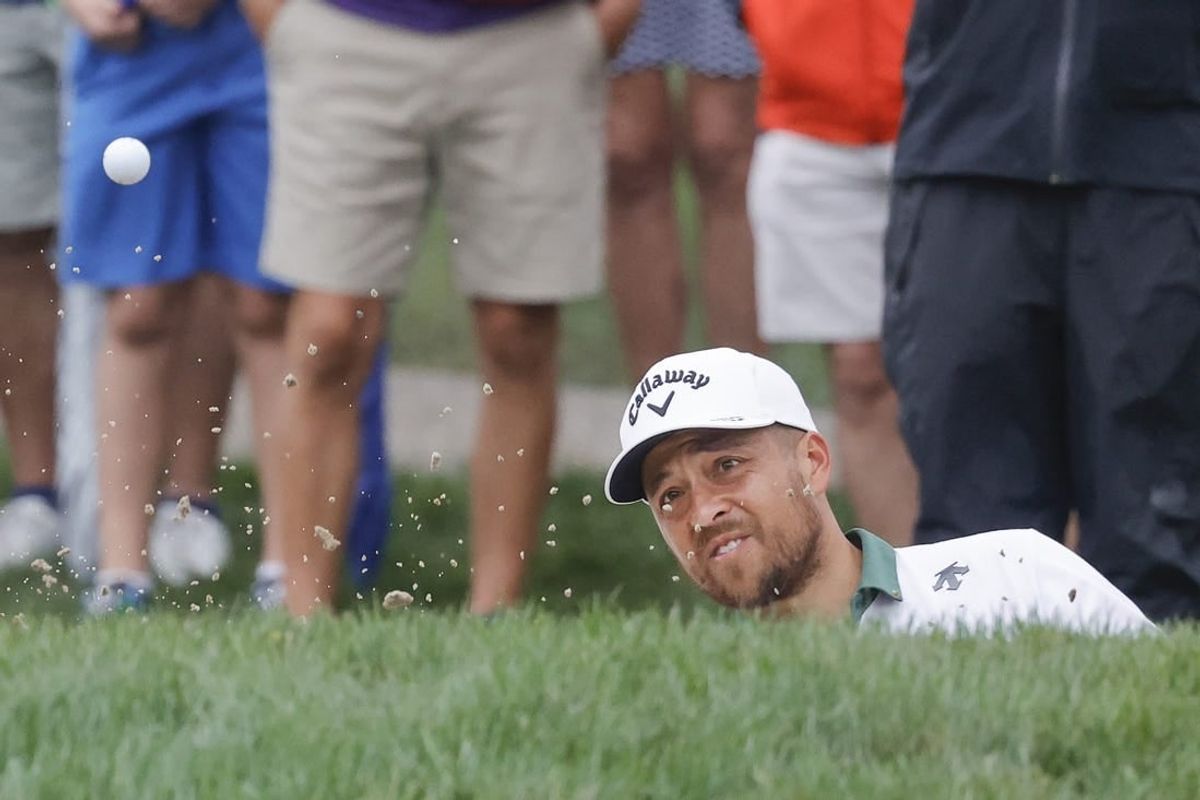 Mar 22, 2024; Palm Harbor, Florida, USA; Xander Schauffele hits from the bunker on the fifth green during the second round of the Valspar Championship golf tournament.