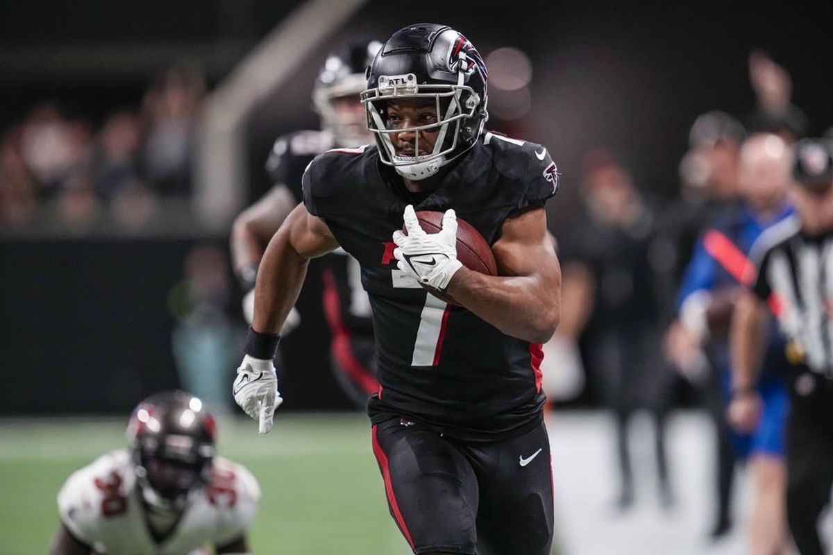 Dec 10, 2023; Atlanta, Georgia, USA; Atlanta Falcons running back Bijan Robinson (7) runs against the Tampa Bay Buccaneers during the second half at Mercedes-Benz Stadium.