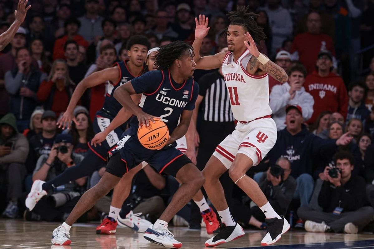 Nov 19, 2023; New York, New York, USA; Connecticut Huskies guard Tristen Newton (2) dribbles as Indiana Hoosiers guard CJ Gunn (11) defends during the second half at Madison Square Garden.