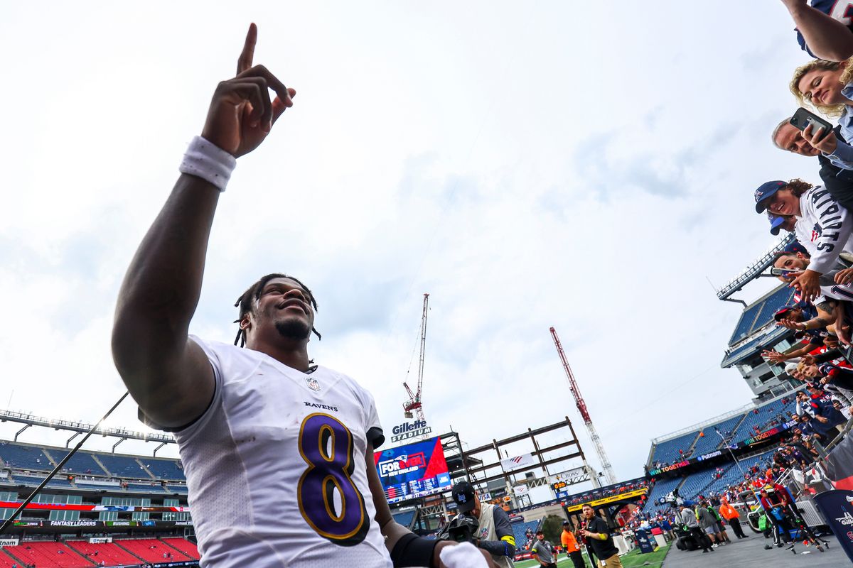 Lamar Jackson points to his dollar value.