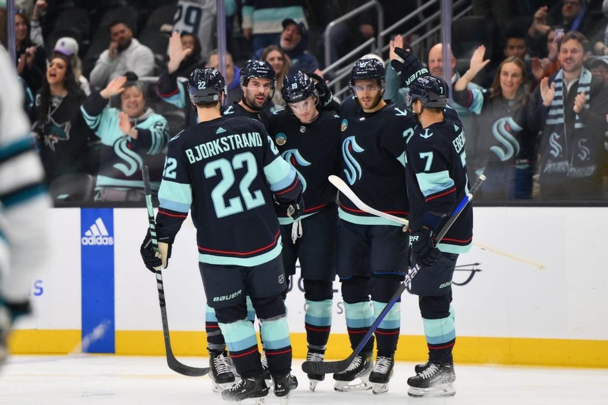 Nov 22, 2023; Seattle, Washington, USA; The Seattle Kraken celebrate after a goal scored by left wing Jared McCann (19) during the second period against the San Jose Sharks at Climate Pledge Arena.